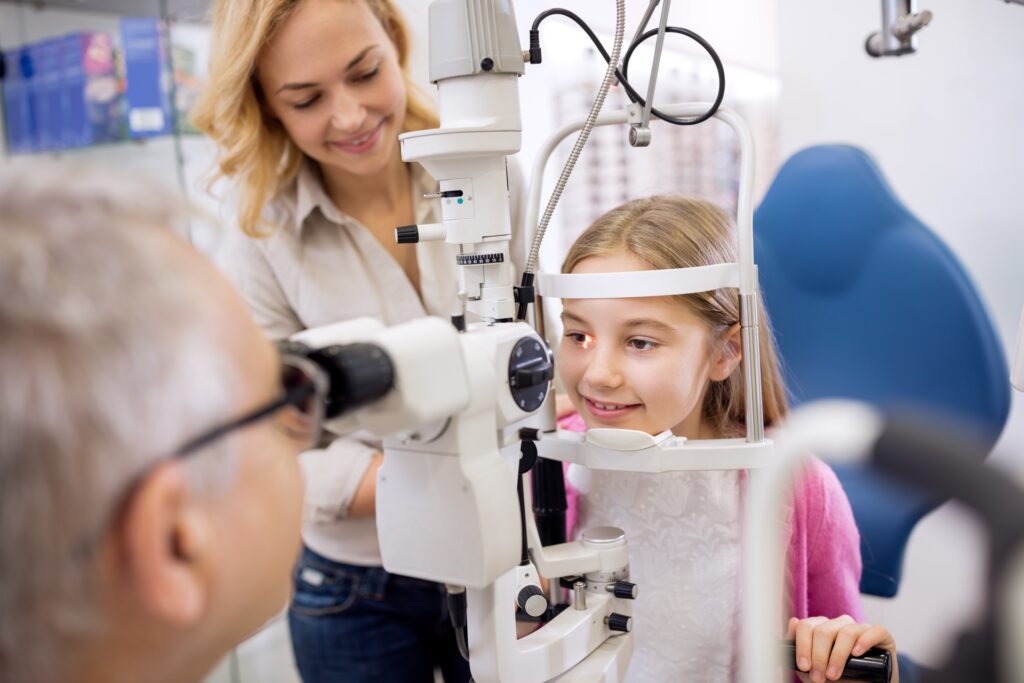 Optometrist treating child with myopia